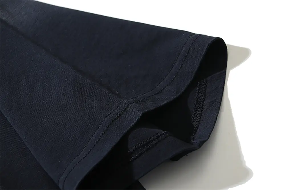 Precision cutting and sewing techniques on sleeves.