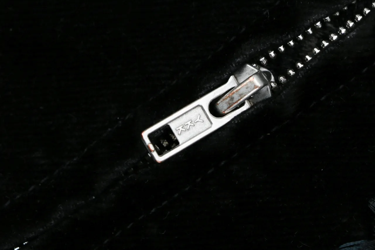 Silver metal zipper pull on