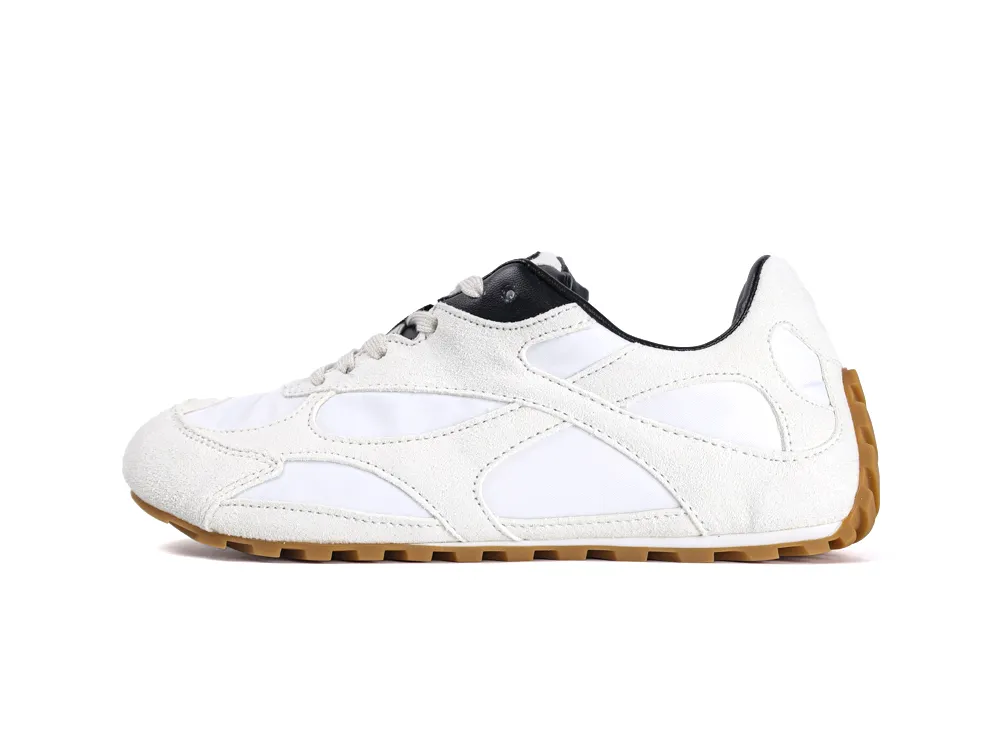 White leather sneaker with suede accents and gum rubber sole.
