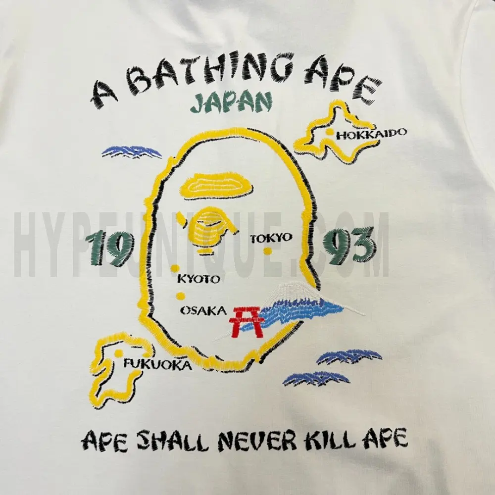 Close-up of the T-shirt embroidered details of the back of the white clothes.