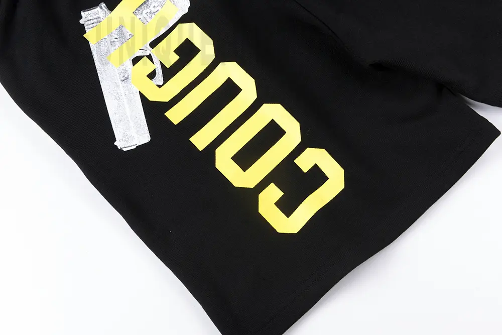 Black trouser leg with logo "cougu"