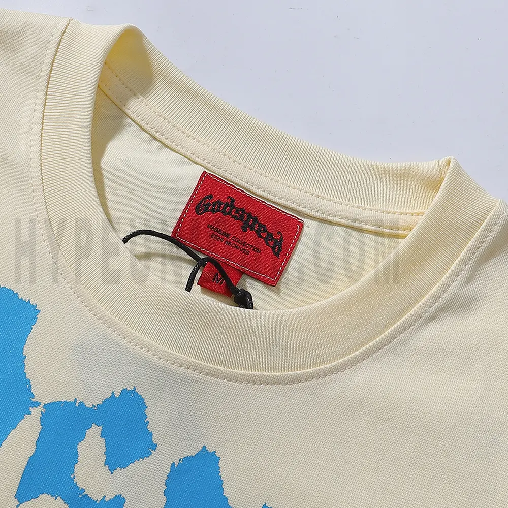 Close-up of the T-shirt's neckline tag, showcasing wash care instructions and brand details in a fashion design.
