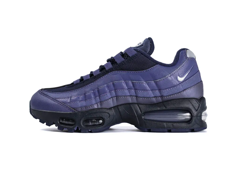 Dark purple and black sneaker with leather and mesh material, featuring an air-cushioned sole.