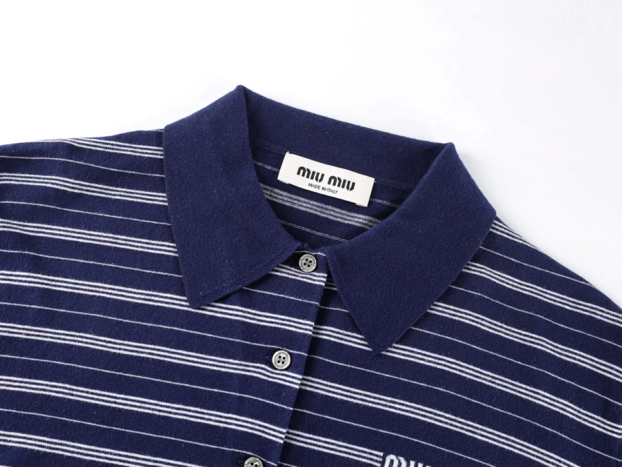 Dark blue and white striped cotton shirt with a button-up collar.
