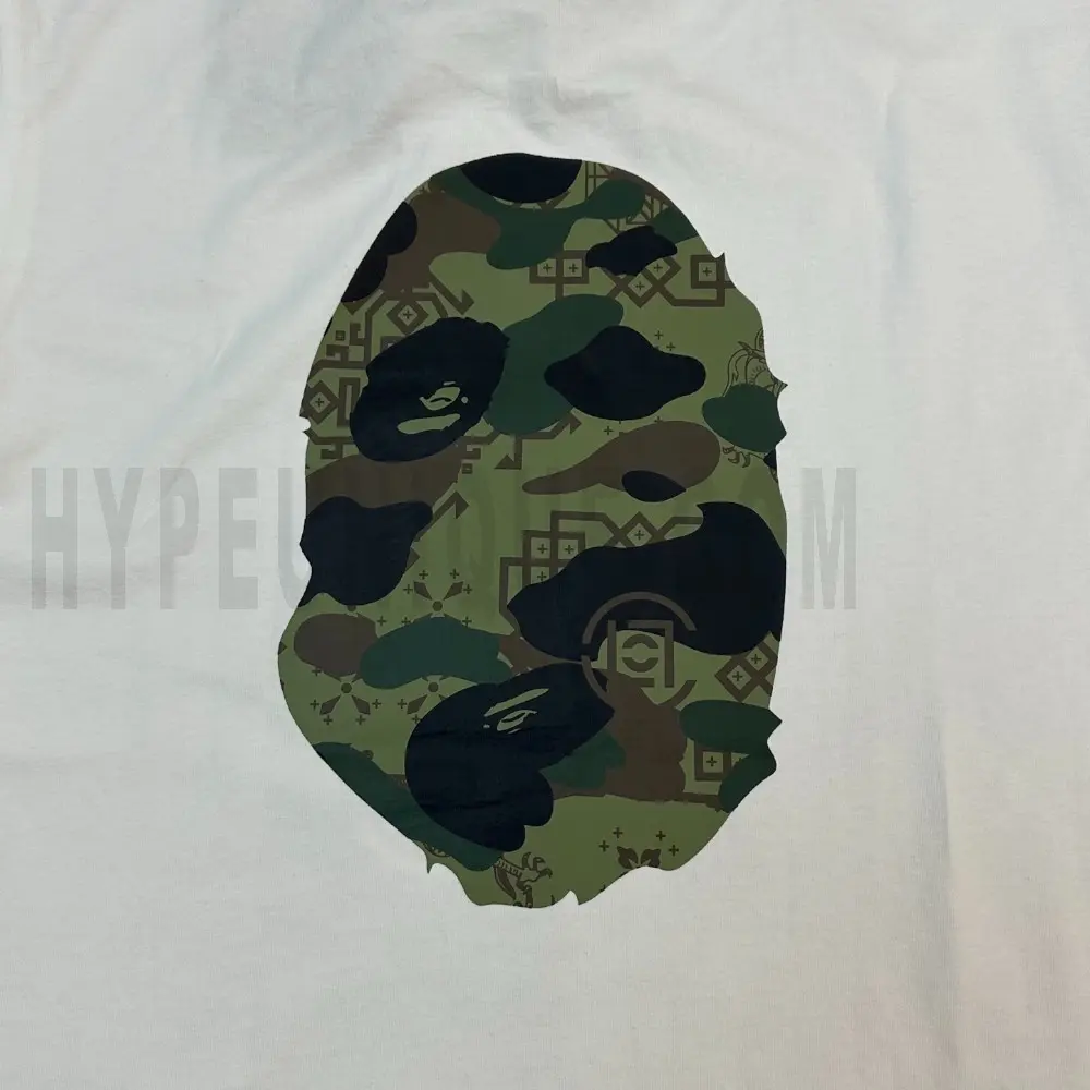 Detailed shot capturing the graphic print on the white tee's back panel.
