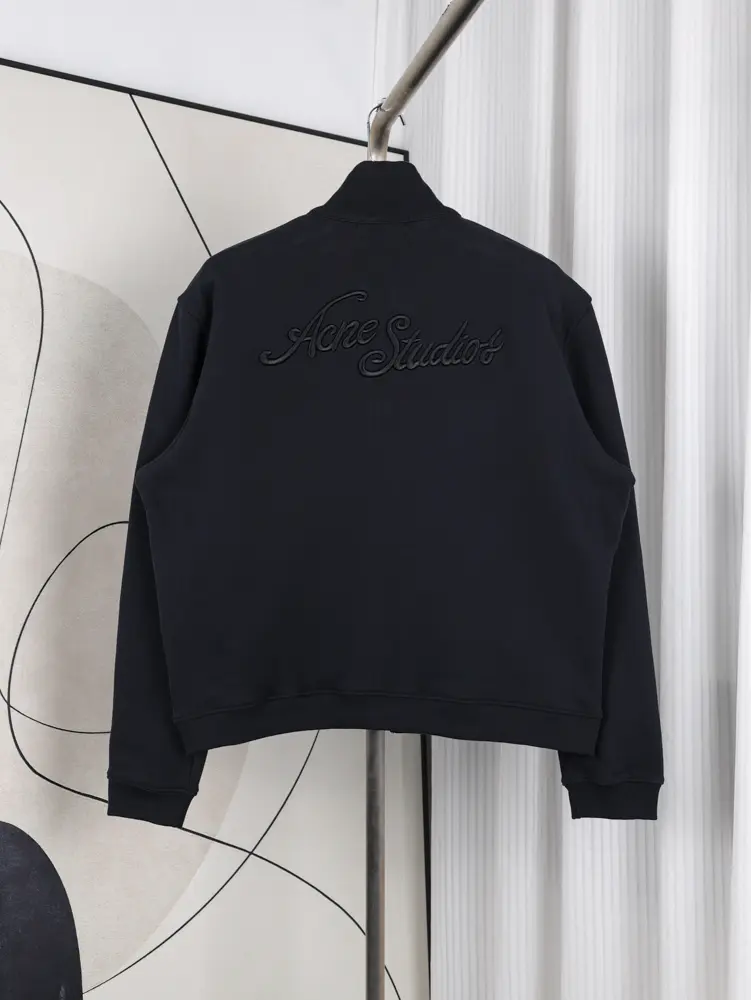 A back view of the Acne Studios Zip-Up Sweatshirt, showcasing its deep black distressed vintage tone and premium fabric.