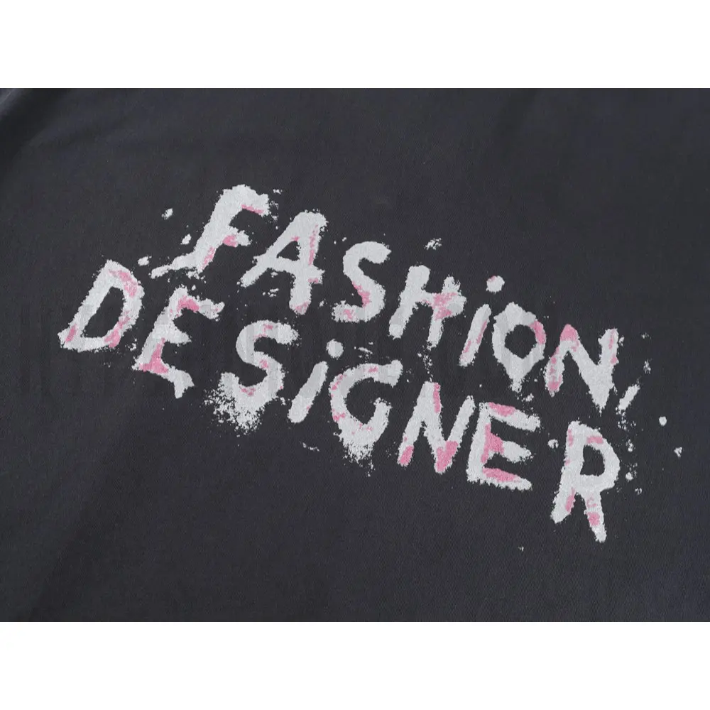 Detailed shot capturing the graphic print on the black tee's front panel.
