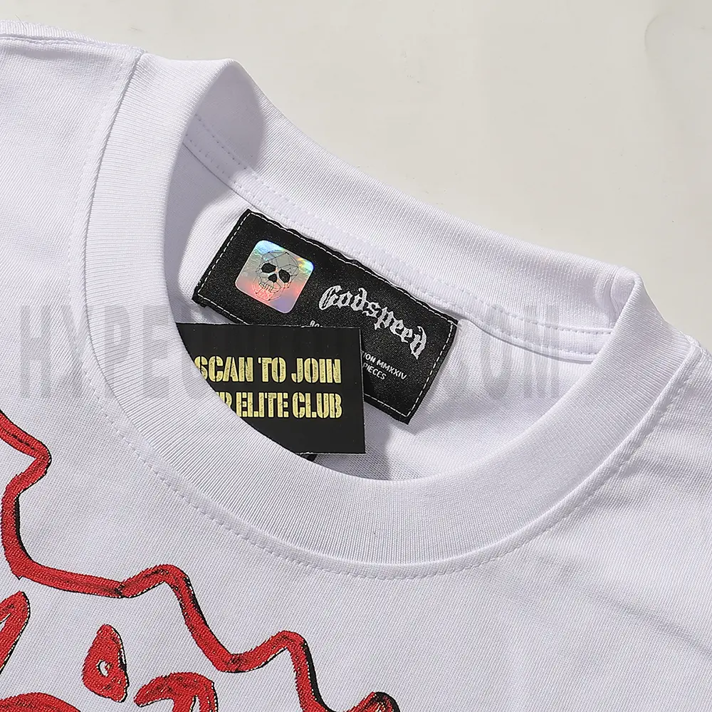 Close-up of the T-shirt's neckline tag, showcasing wash care instructions and brand details in a fashion design.