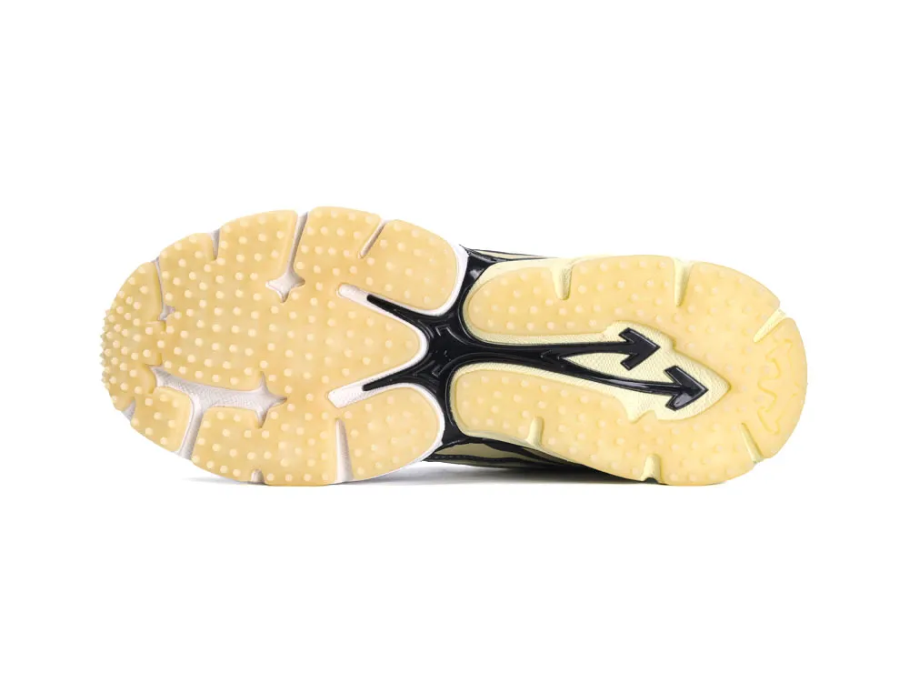 Yellow rubber outsole with black arrow design for enhanced traction and style.