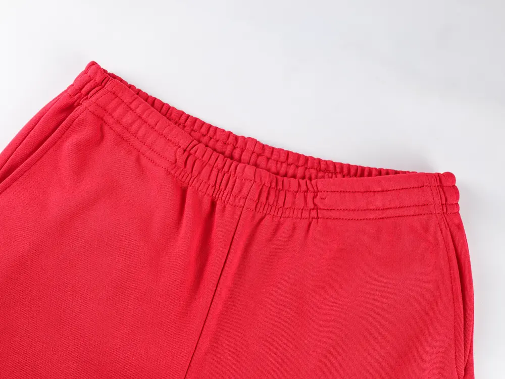 At the trouser legs