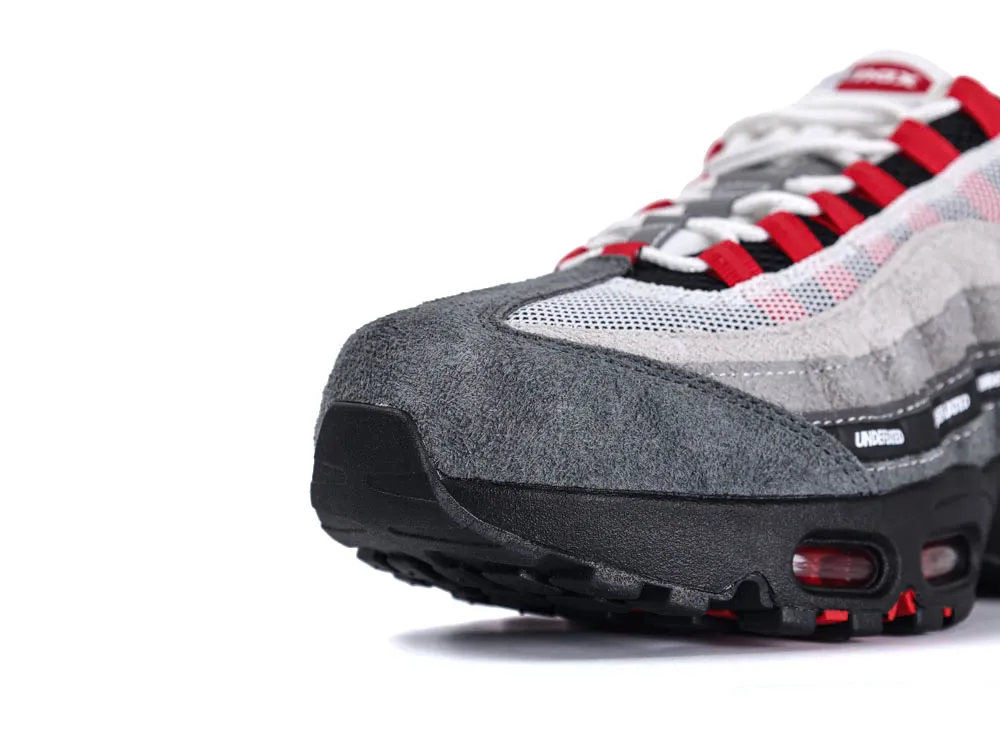 Gray suede and mesh sneaker with black sole and red accents.