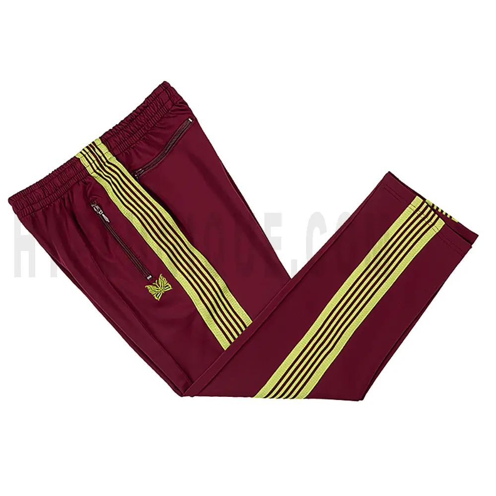 Side view of red track pants.