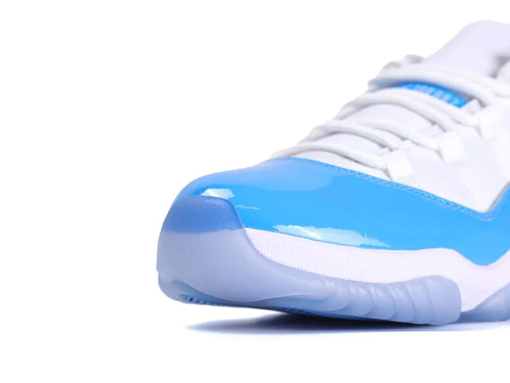 Close-up of white sneaker with blue patent leather toe, featuring a translucent sole.