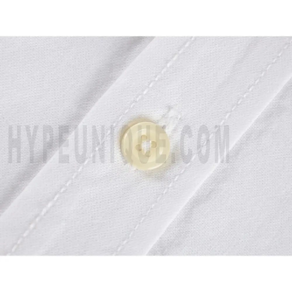 Close-up of button detail on the garment