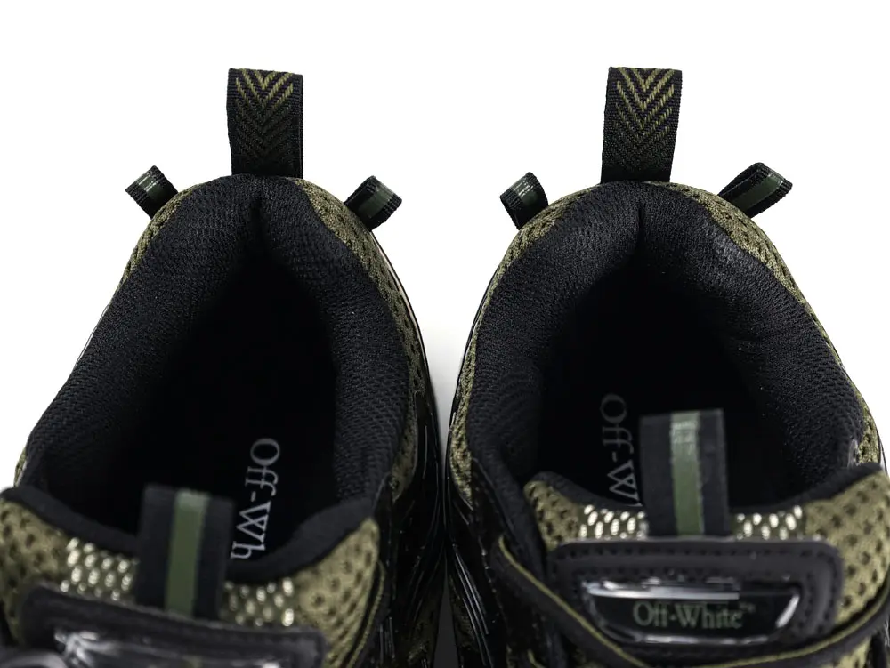 Top view of pair of trainers highlighting padded collar, inner lining, and heel pull tabs