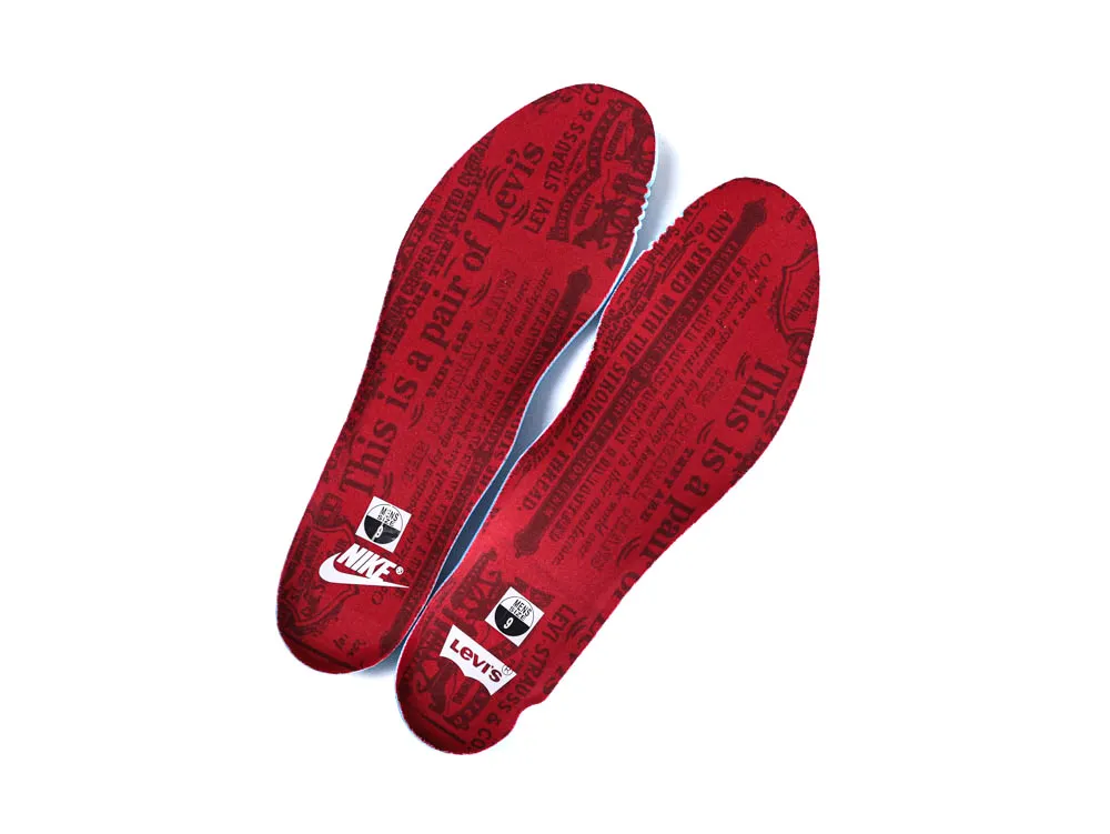 Red insoles with black text print, featuring Nike and Levi's logos.