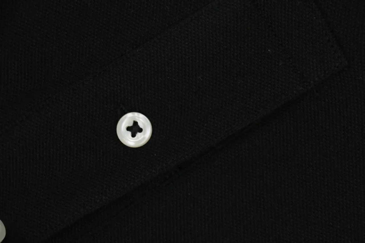 Black fabric with a white button