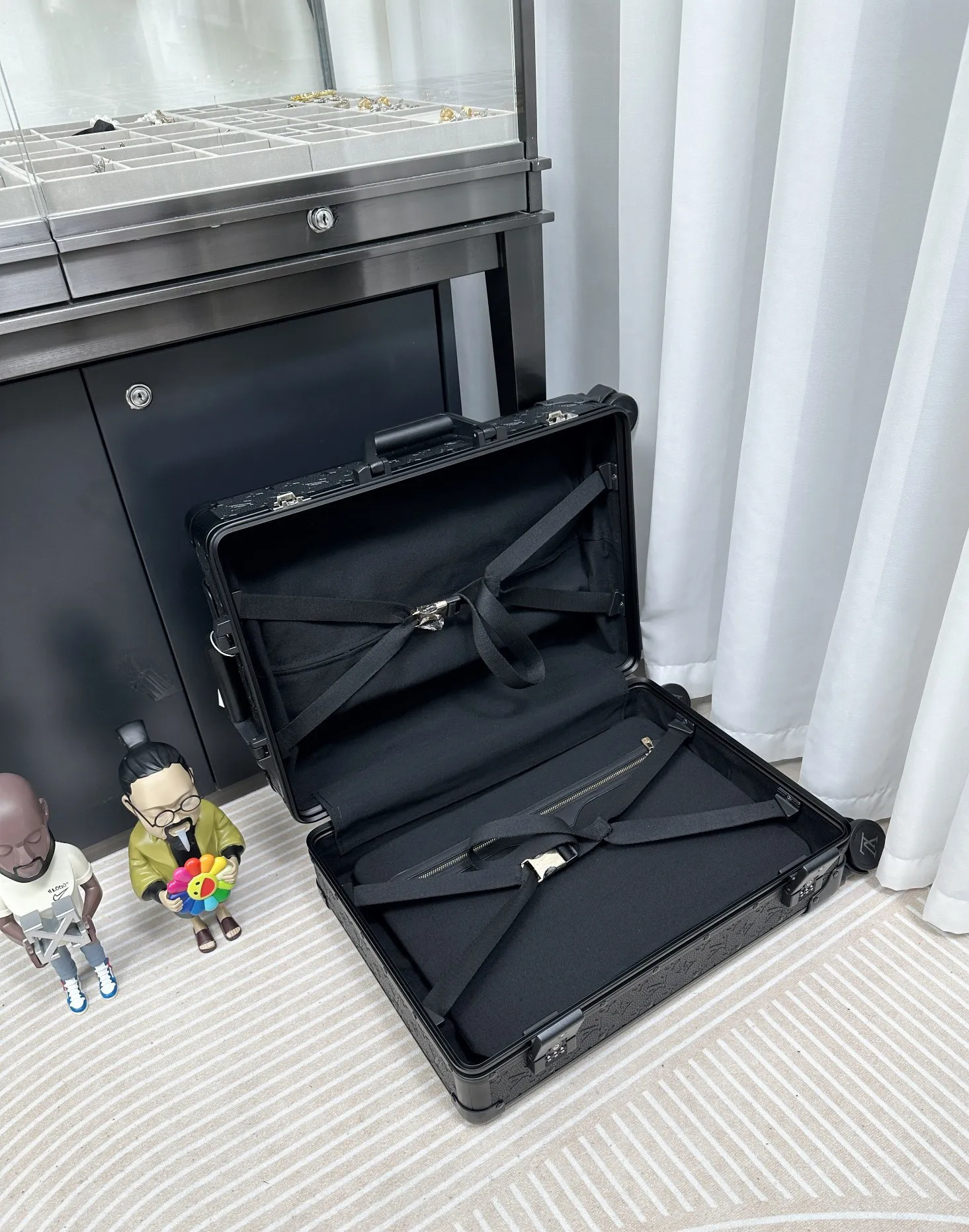 Black embossed monogram luggage interior compartment
