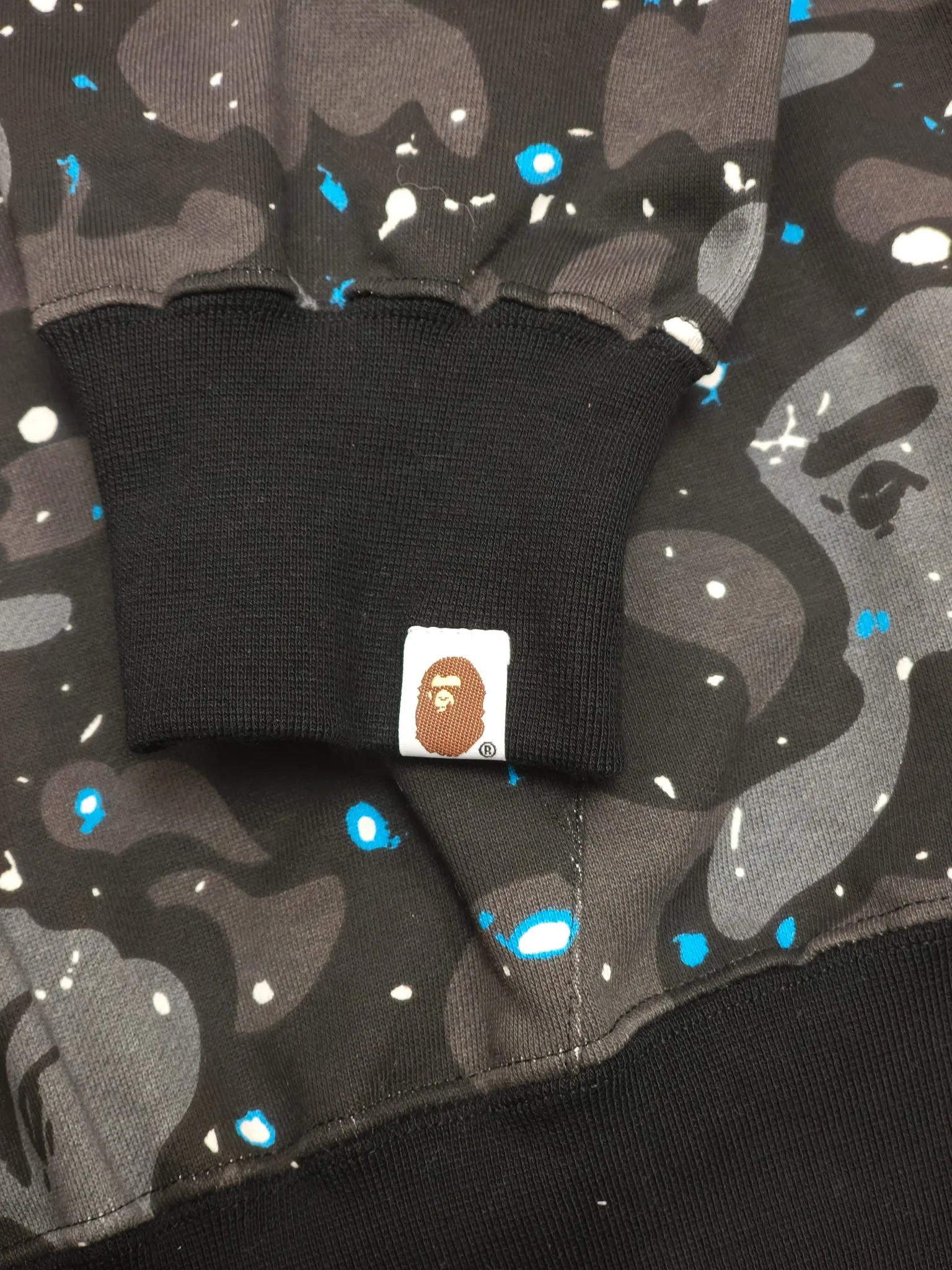 Sleeve cuff with logo