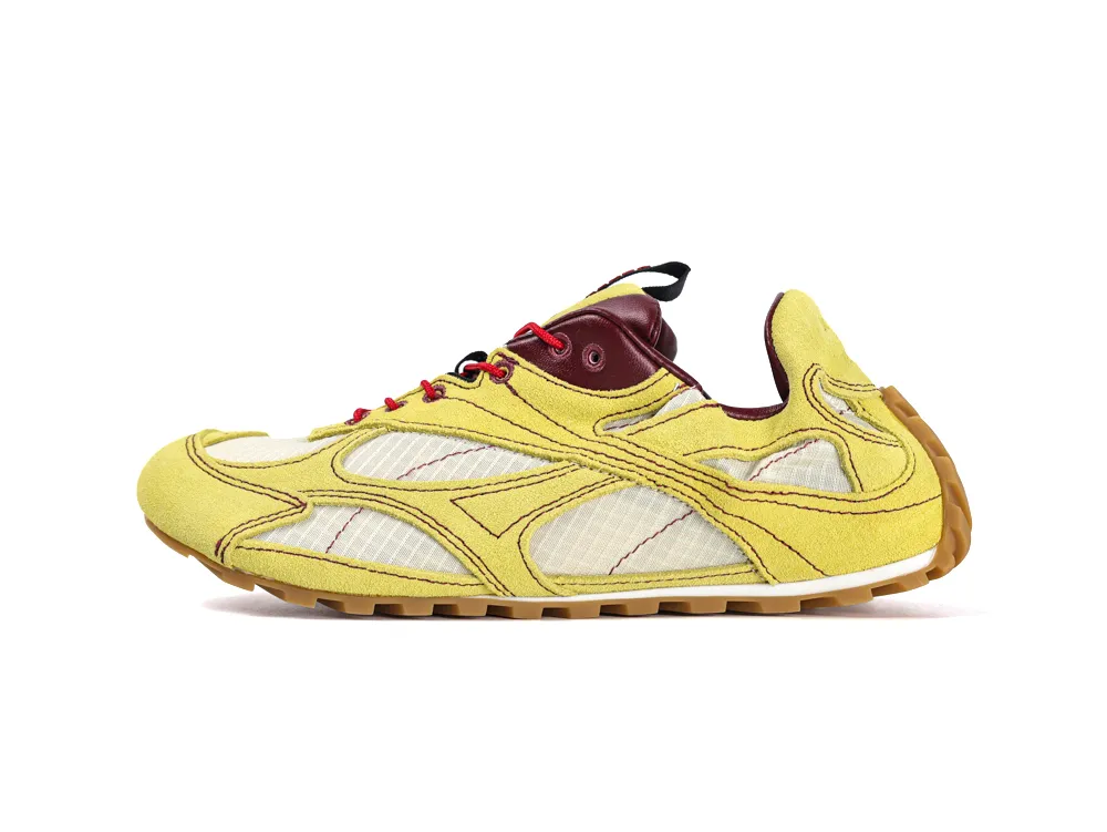 Yellow suede sneaker with mesh panels, maroon leather accents, and gum sole.