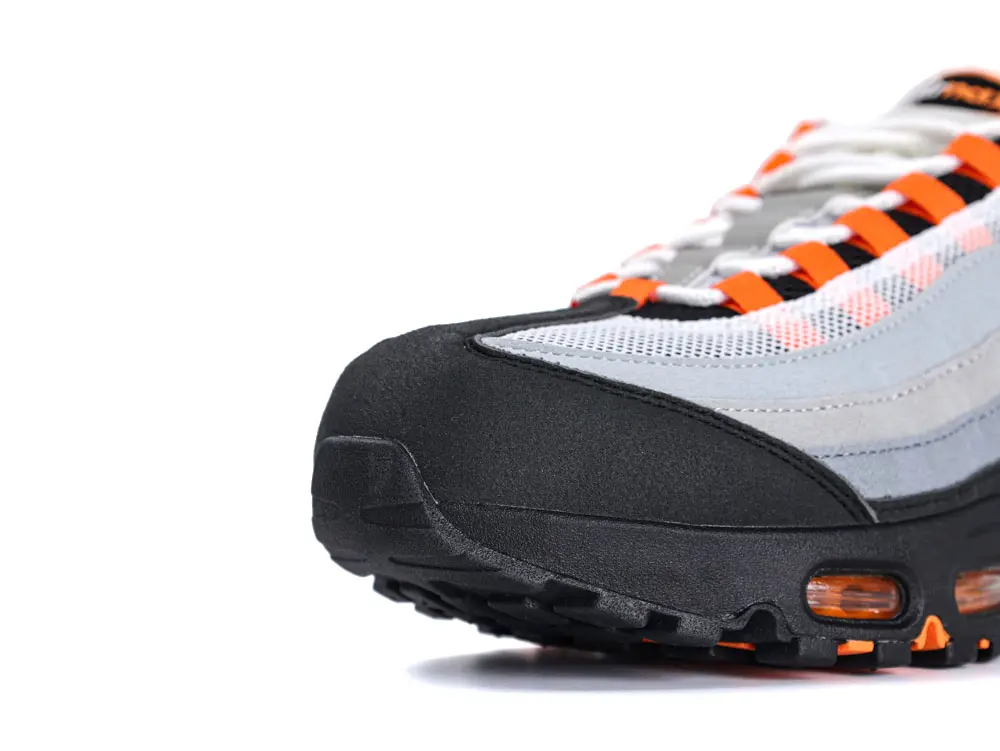 Shoe sole with orange accents.