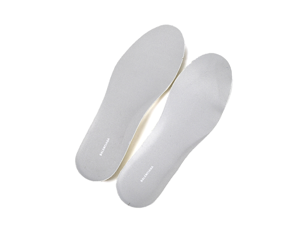 Gray textured insoles made from synthetic material, designed for comfort and support.