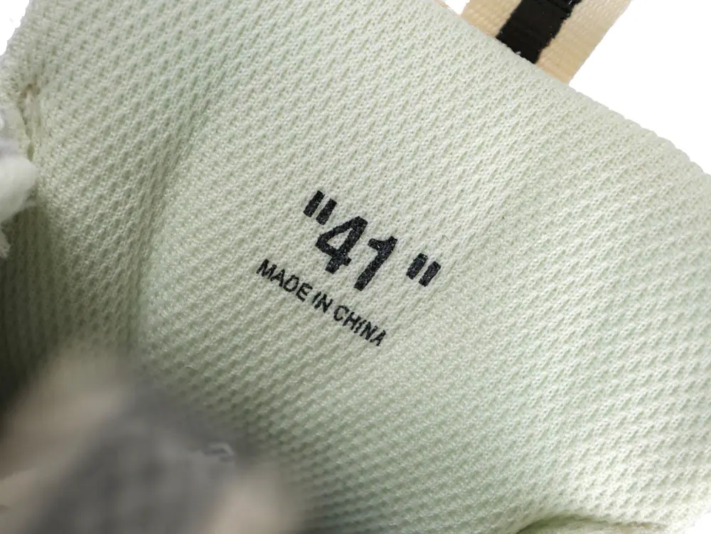 White mesh sneaker interior with size "41" label, made in China.