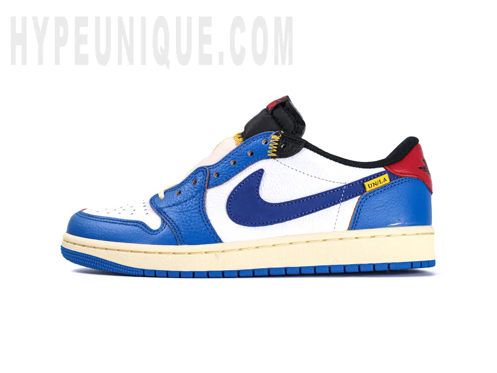 A front view of the Union LA Jordan 1 Retro Low NRG ‘Storm Blue’ on the left foot. Showing the blue and white colorway and leather material.