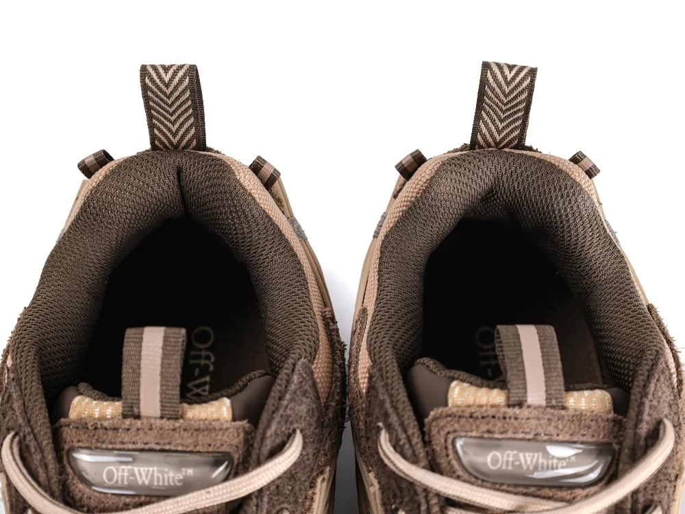 Close-up of brown sneakers with fabric lining and pull tabs.