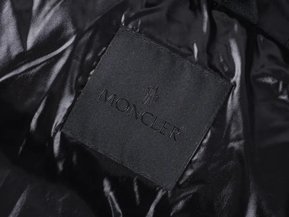 Moncler logo on dark fabric