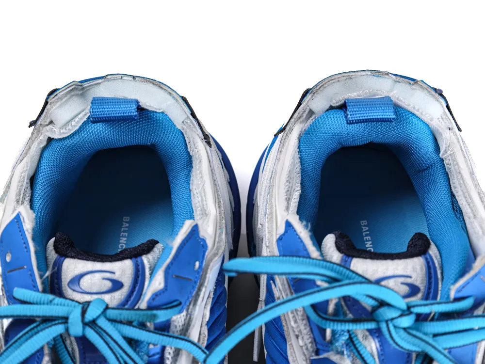 Blue and white sneakers with padded interior, mesh material, and fabric laces.