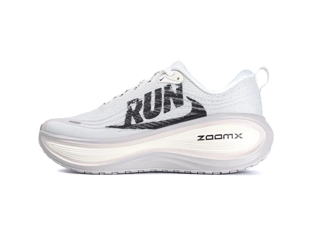 White mesh running shoe with black logo, foam midsole, and rubber outsole.