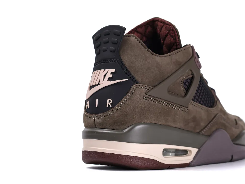 Brown suede sneaker with black accents and air cushioning on the midsole.