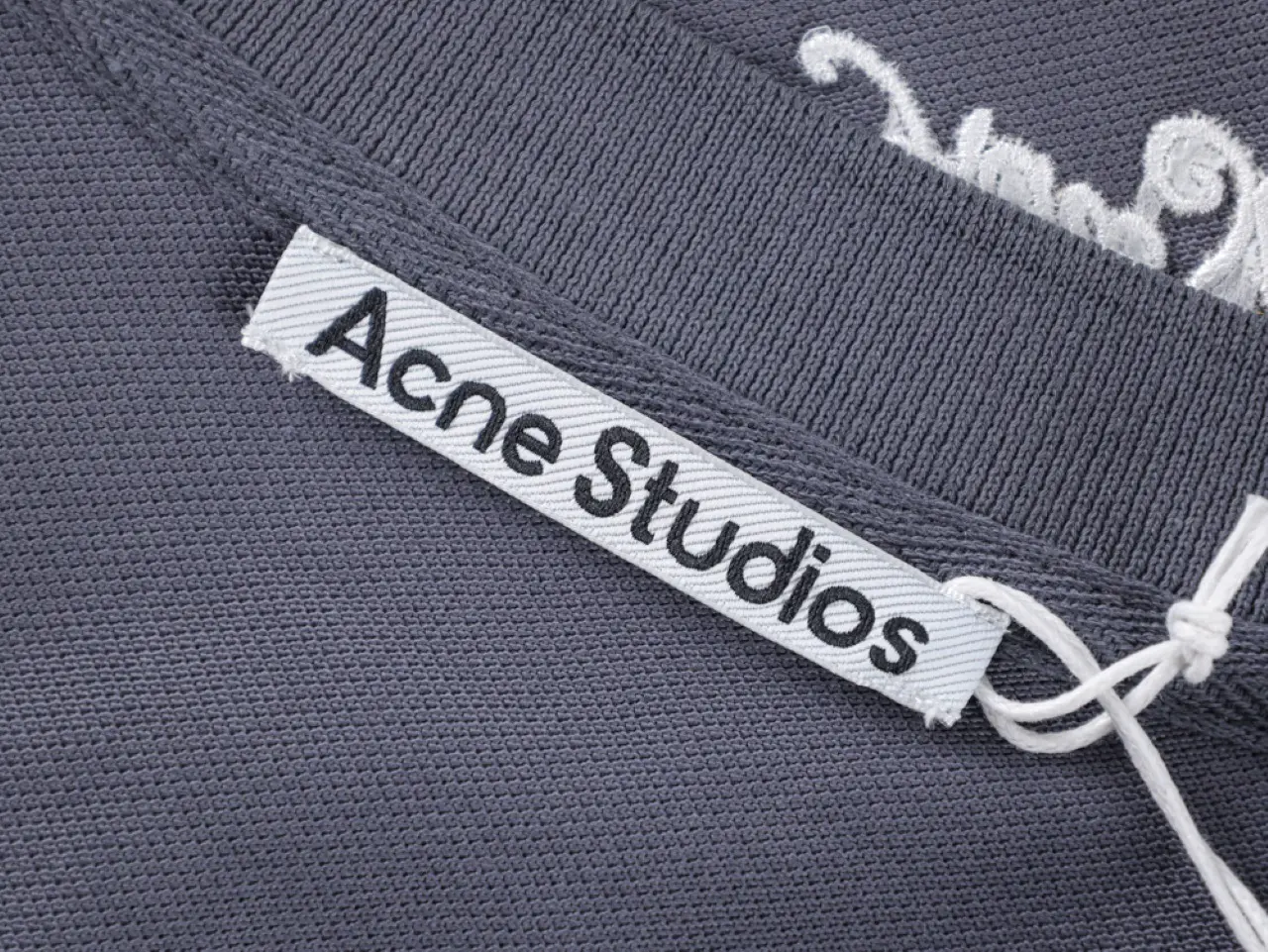 the acne studios neck tag