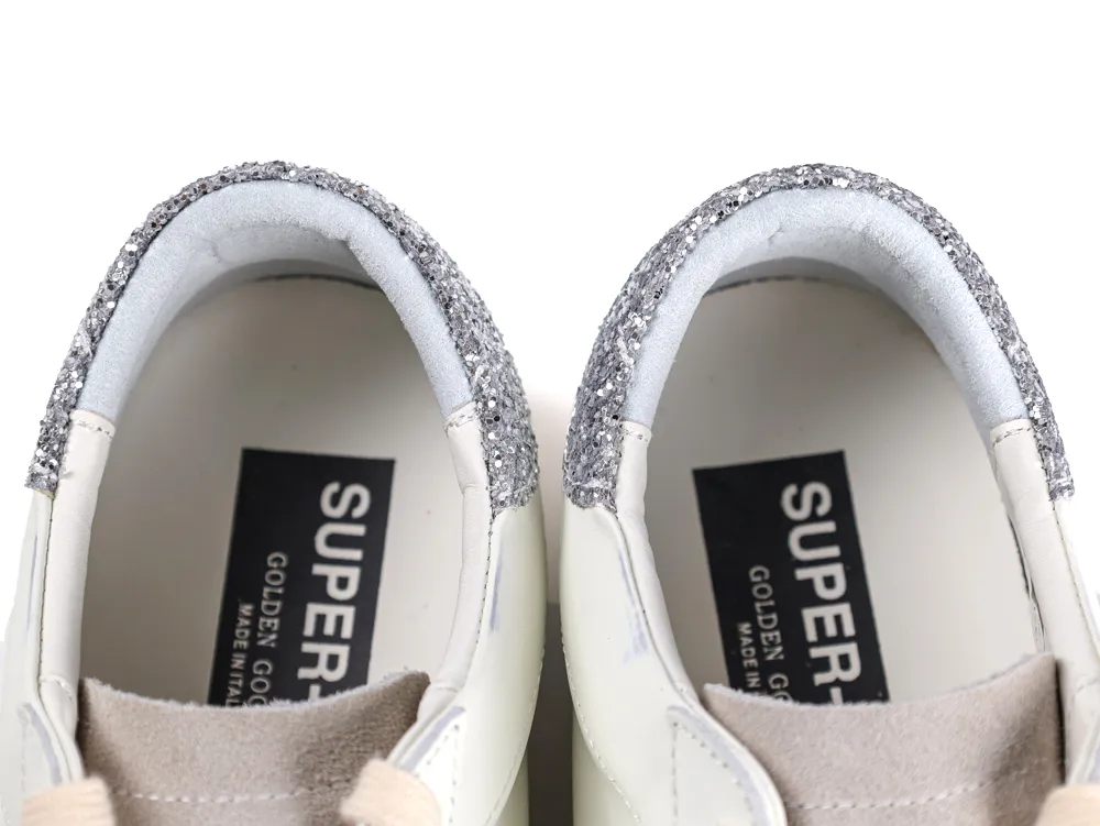 Interior view of Golden Goose sneakers showing black logo branding labels