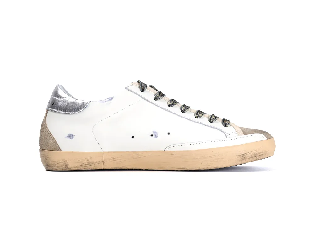 Medial side view of white Golden Goose sneaker with leopard laces