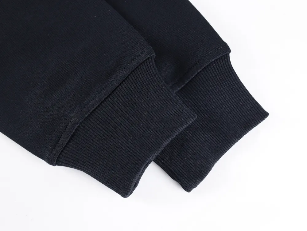 Close-up of black ribbed cotton sweatshirt cuffs