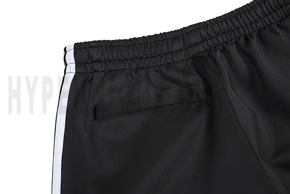 Detail of the back pocket on the track pants.