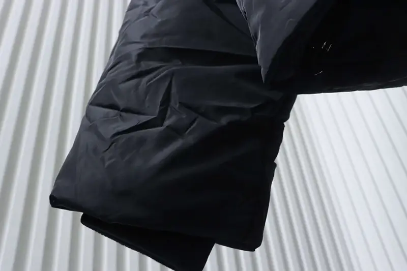 Black puffer jacket close-up detail