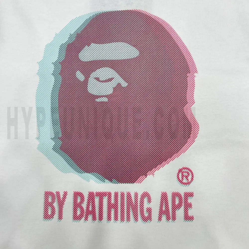 Detailed shot capturing the graphic print on the white tee's front panel.