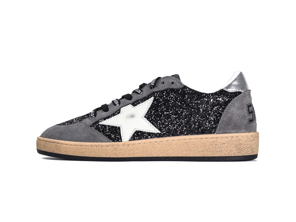 Lateral side view of black glitter Golden Goose Ball Star sneaker with white star