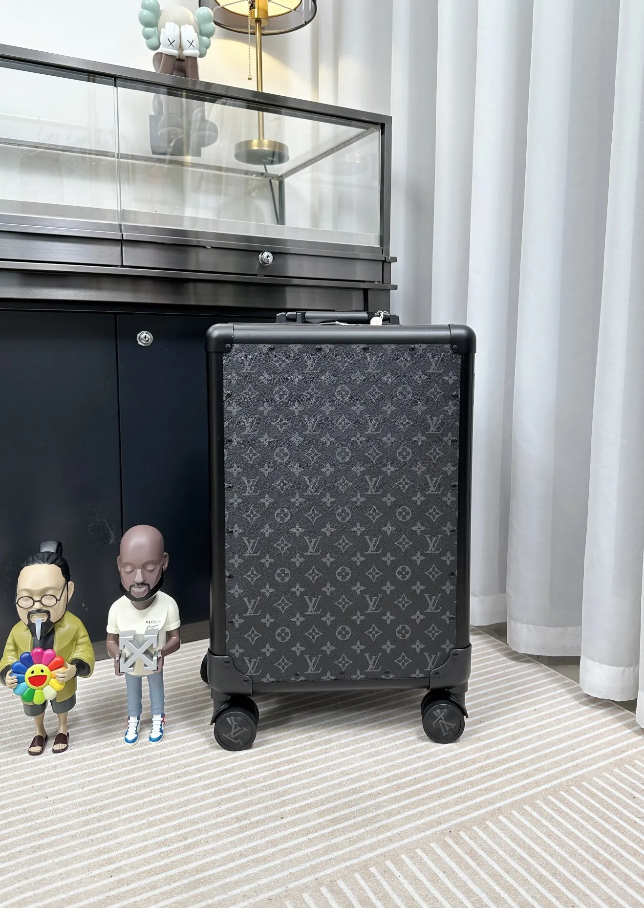 Black monogram rolling travel luggage back view
