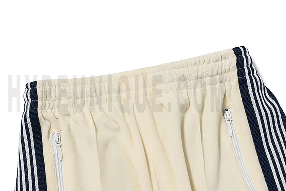 Back detail view of the beige pants