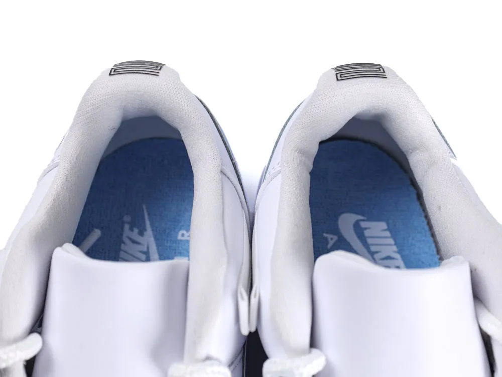 White fabric sneakers with a blue insole and visible brand logo inside.