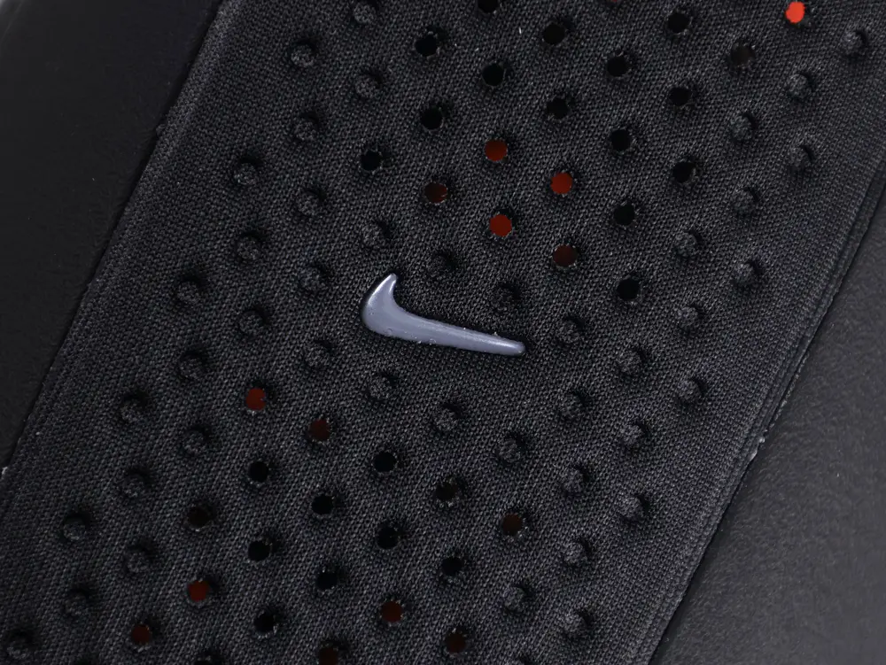 Black fabric with perforated design and a small gray logo displayed.