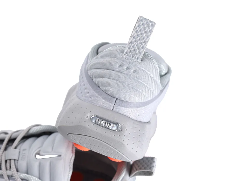 Gray synthetic sneaker with orange accents and textured heel tab.