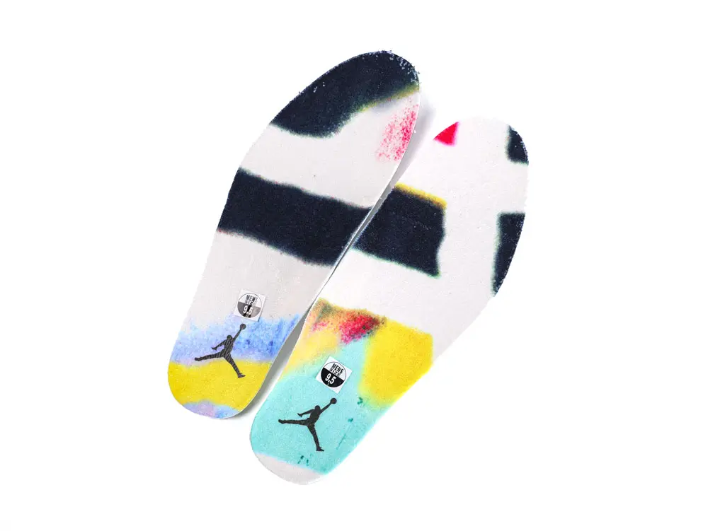 White high-top basketball sneakers.