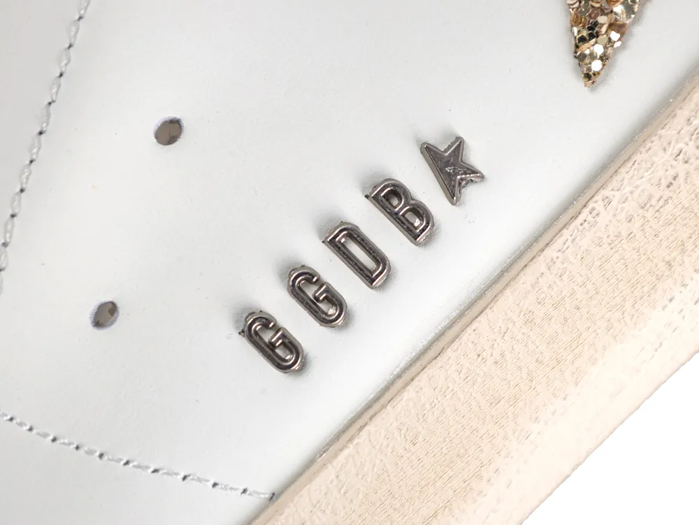 Silver GGDB metal branding on white leather sneaker