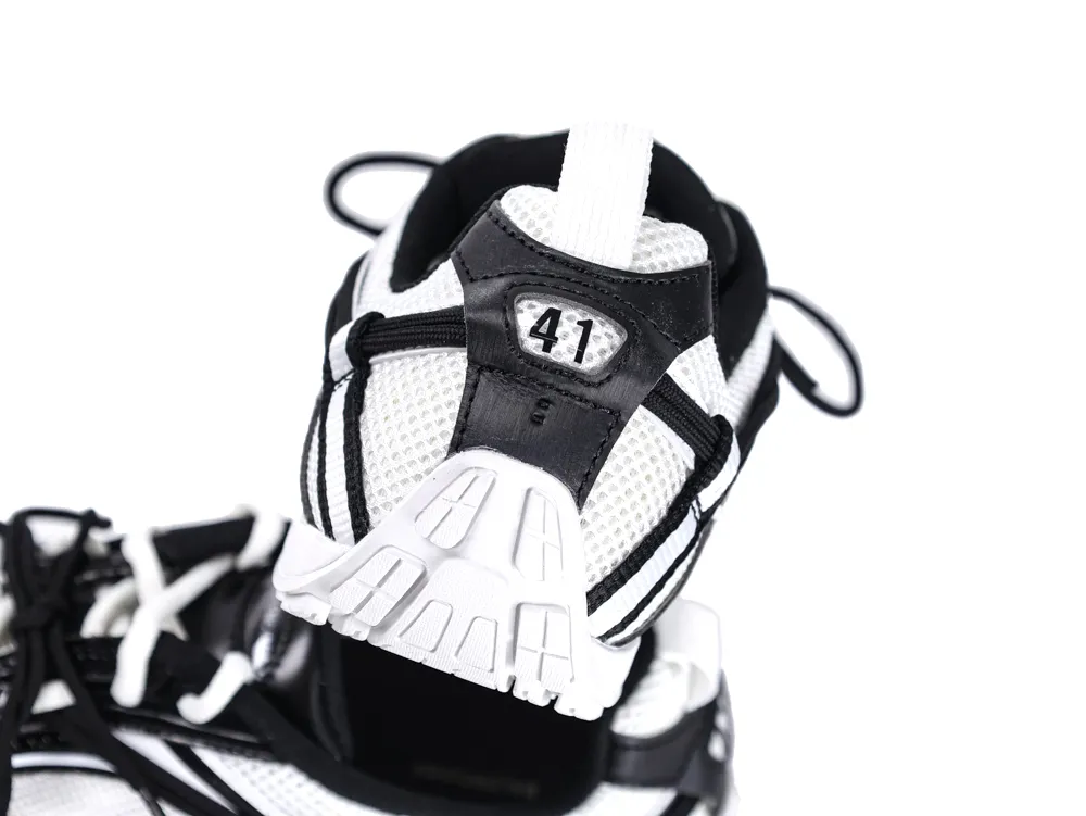 Black and white sneaker with mesh material and rubber sole displaying size 41.