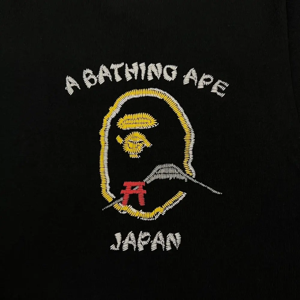 Close-up of the T-shirt embroidered details of the front of the back clothes.
